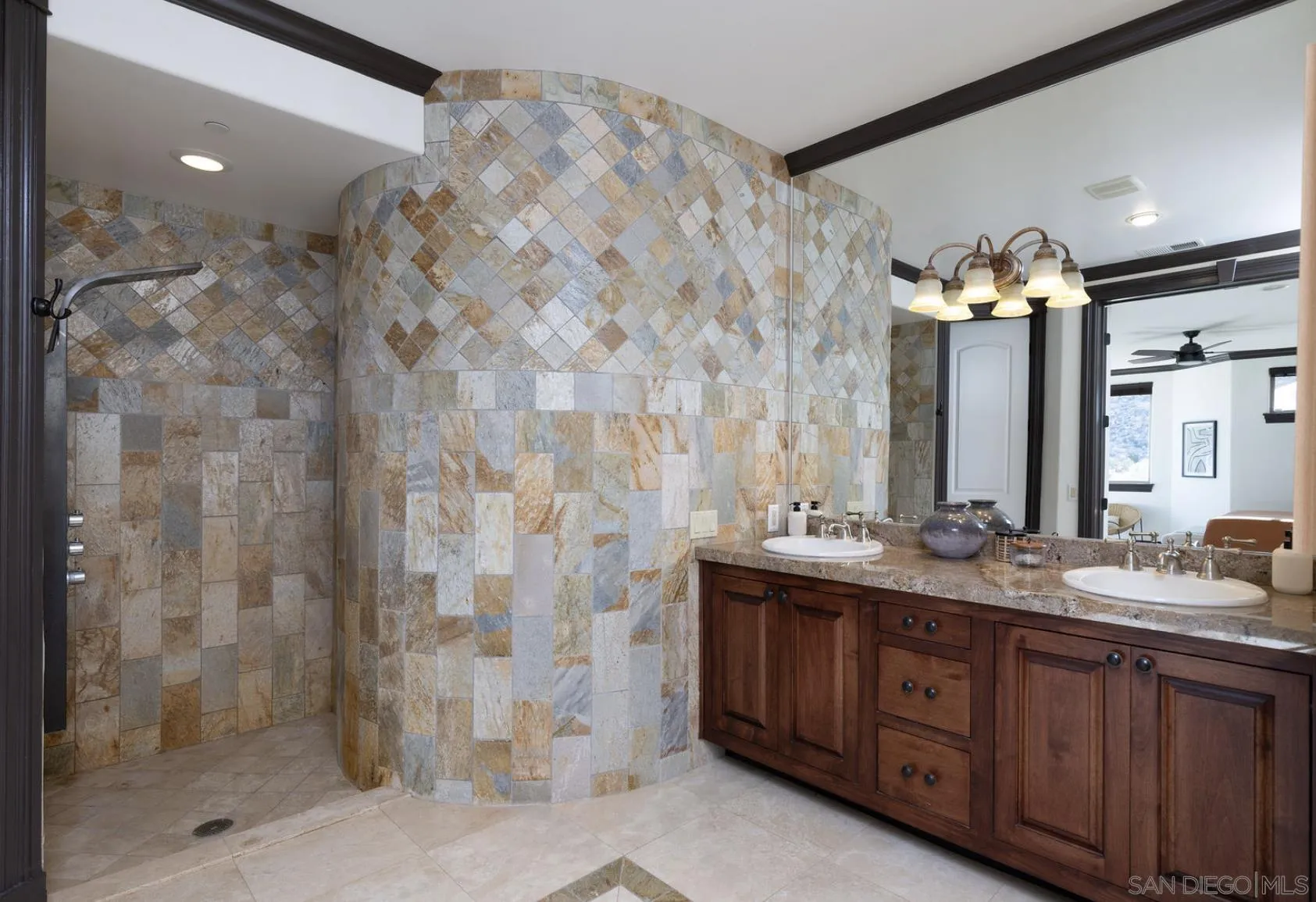 8022 Wesley Road Joshua Tree, CA 92252 - Photo 19 of 69 a bathroom with a double vanity sink mirror and shower
