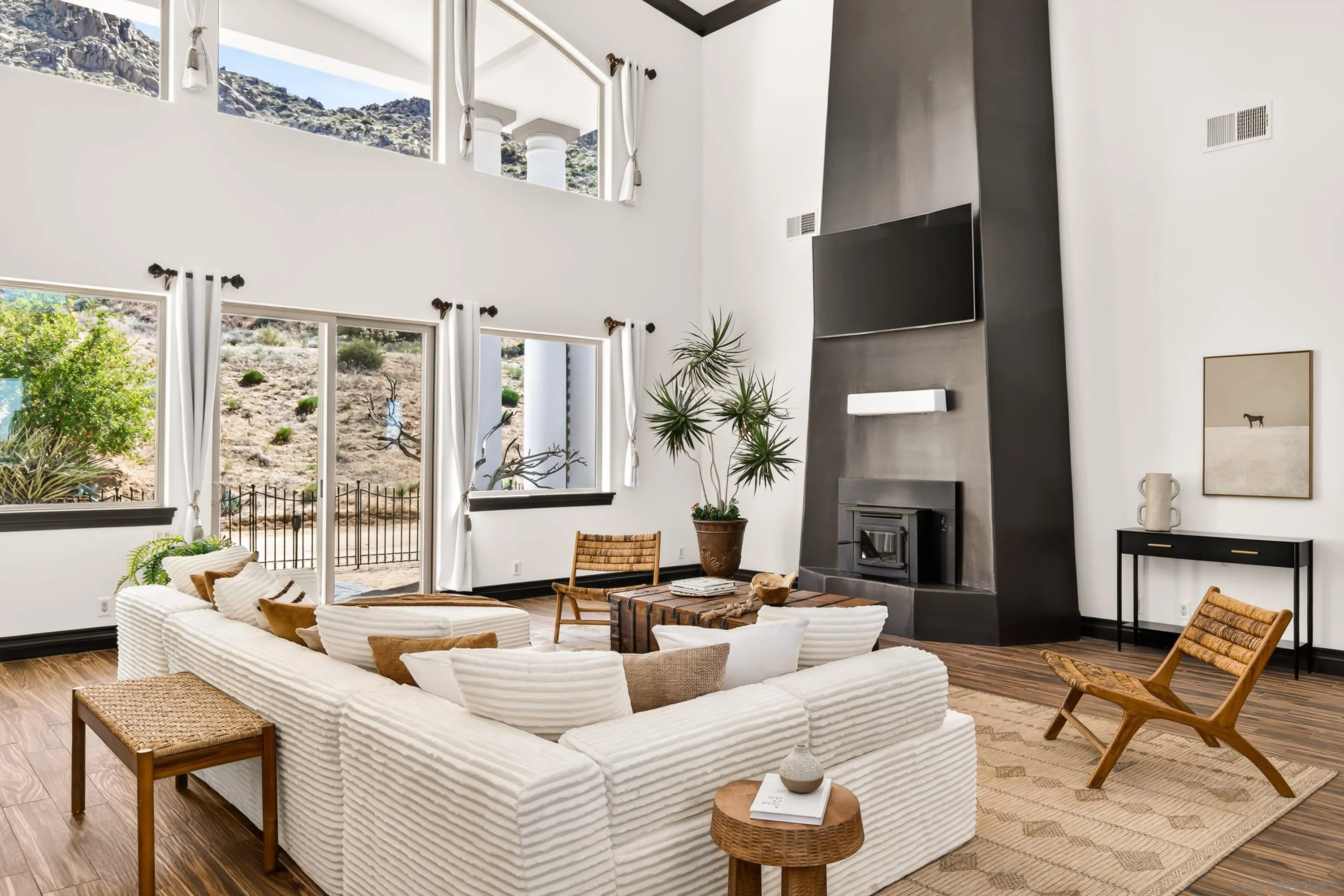 8022 Wesley Road Joshua Tree, CA 92252 - Photo 2 of 69 a living room with furniture and a fireplace