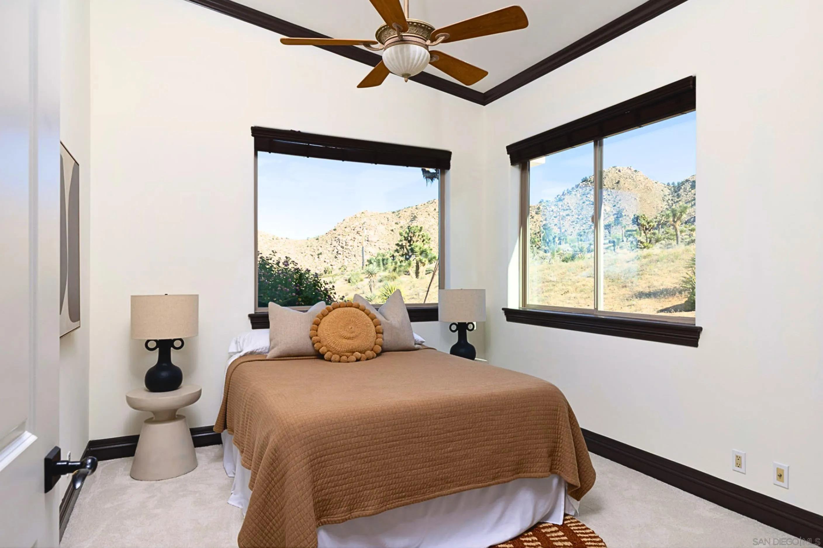 8022 Wesley Road Joshua Tree, CA 92252 - Photo 24 of 69 a bedroom with a bed and a window