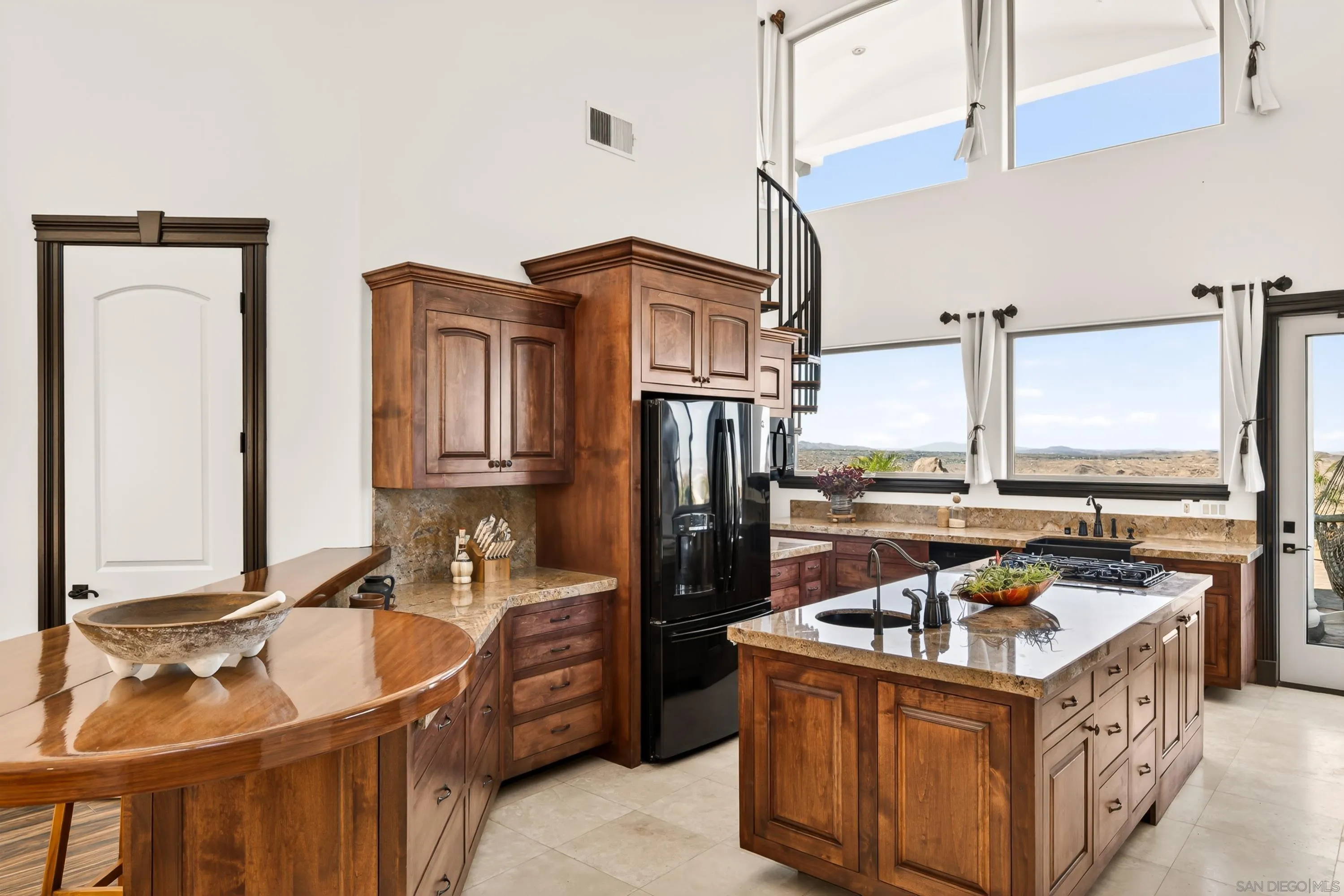 8022 Wesley Road Joshua Tree, CA 92252 - Photo 31 of 69 a kitchen with a stove sink and refrigerator