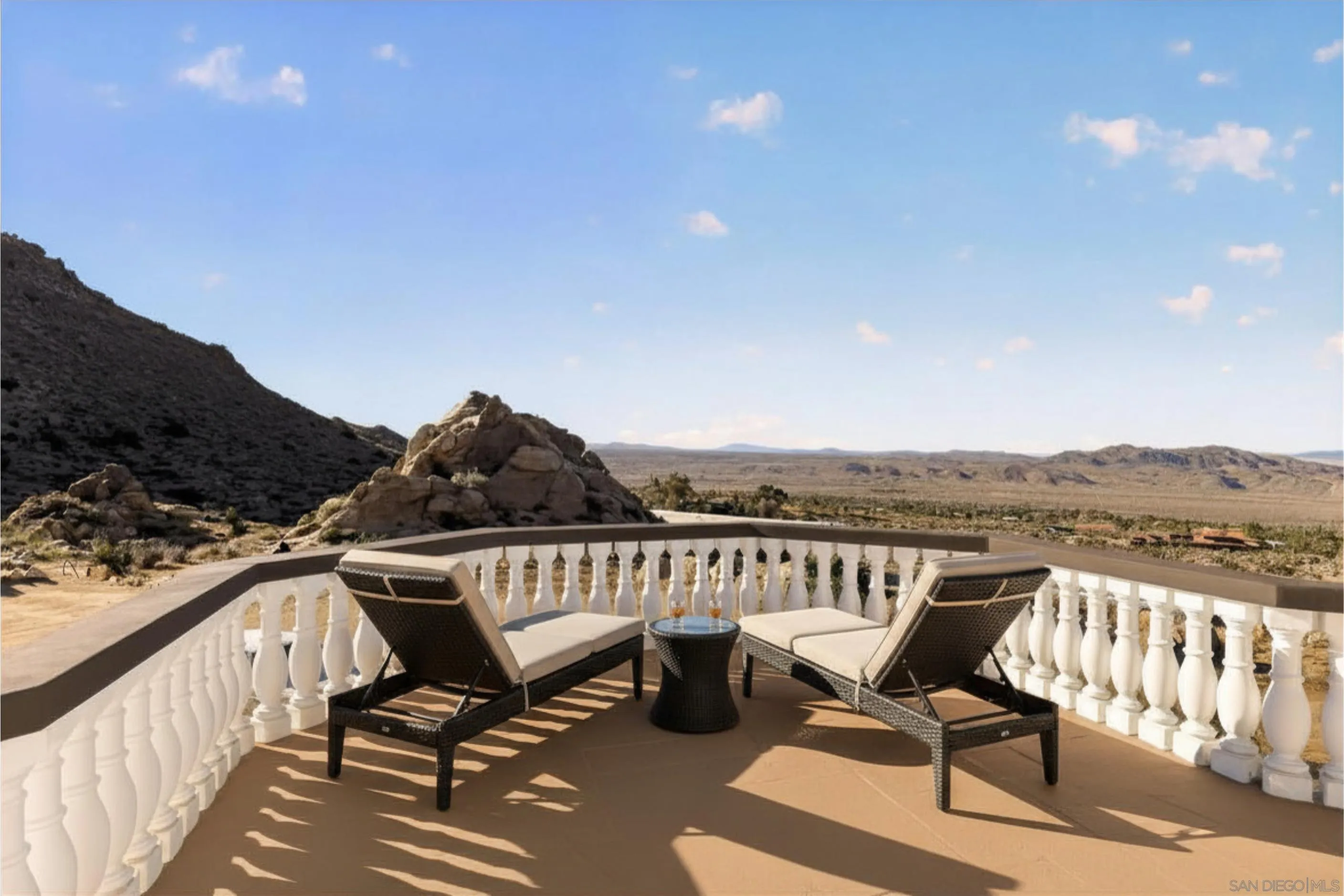 8022 Wesley Road Joshua Tree, CA 92252 - Photo 35 of 69 a view of a chairs and table on wooden deck with lake view