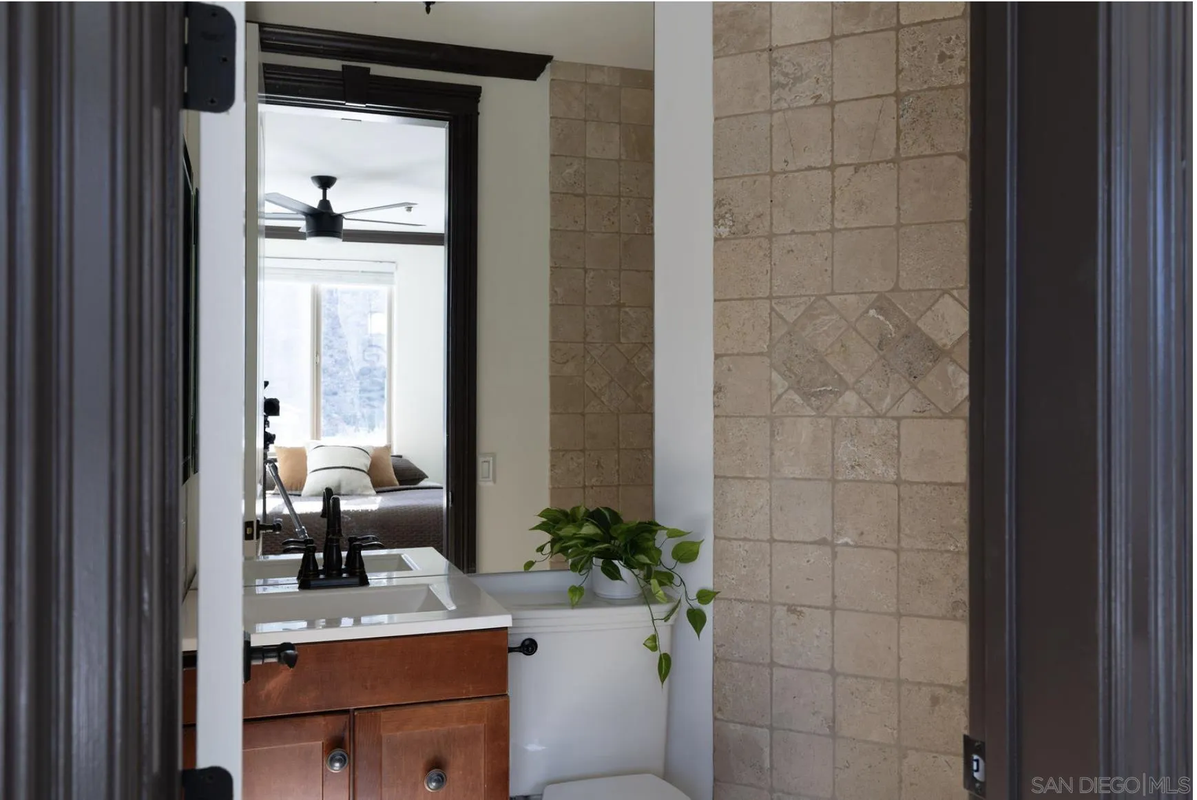8022 Wesley Road Joshua Tree, CA 92252 - Photo 38 of 69 a bathroom with a sink a potted plant and a mirror