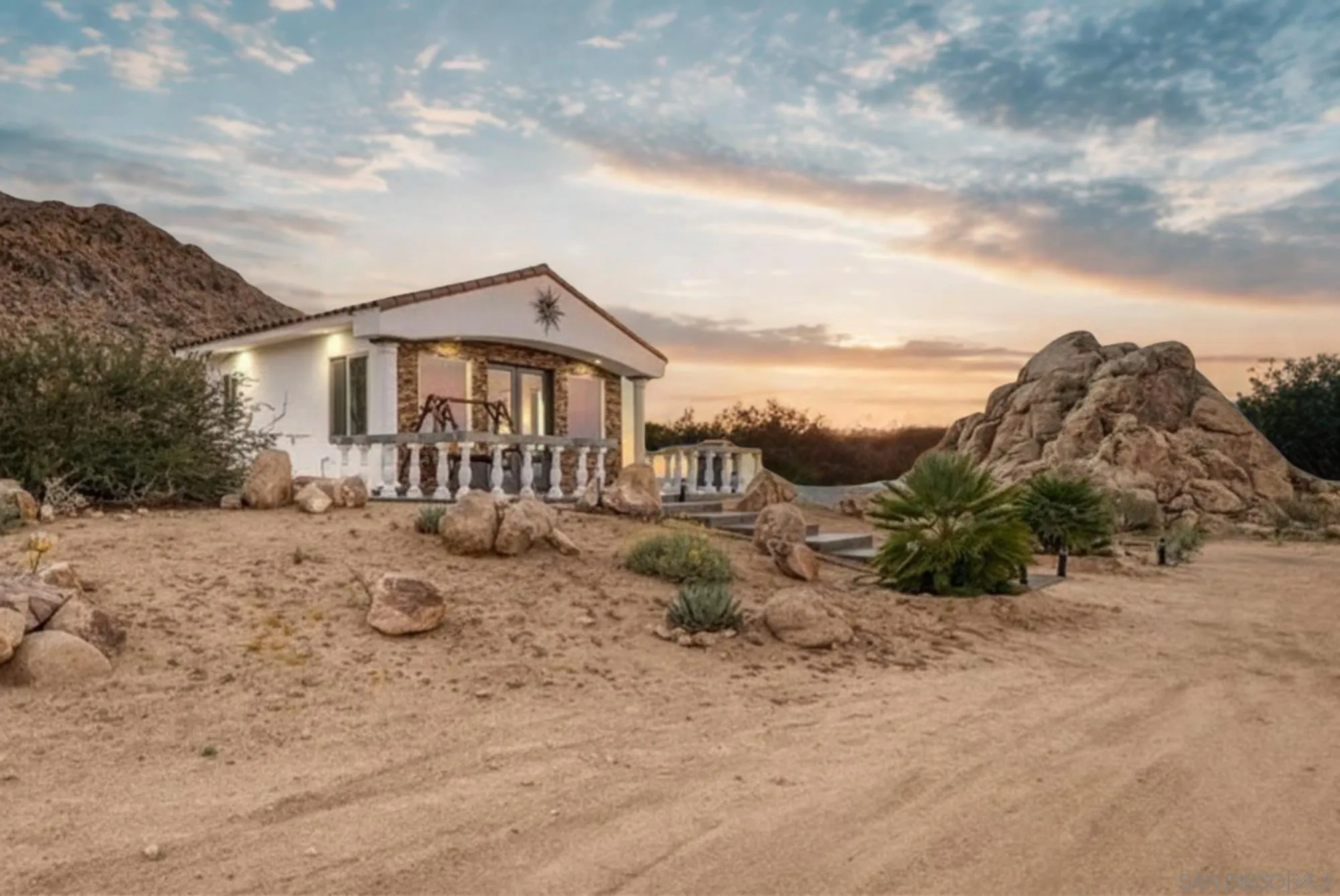 8022 Wesley Road Joshua Tree, CA 92252 - Photo 42 of 69 a view of a house with a yard