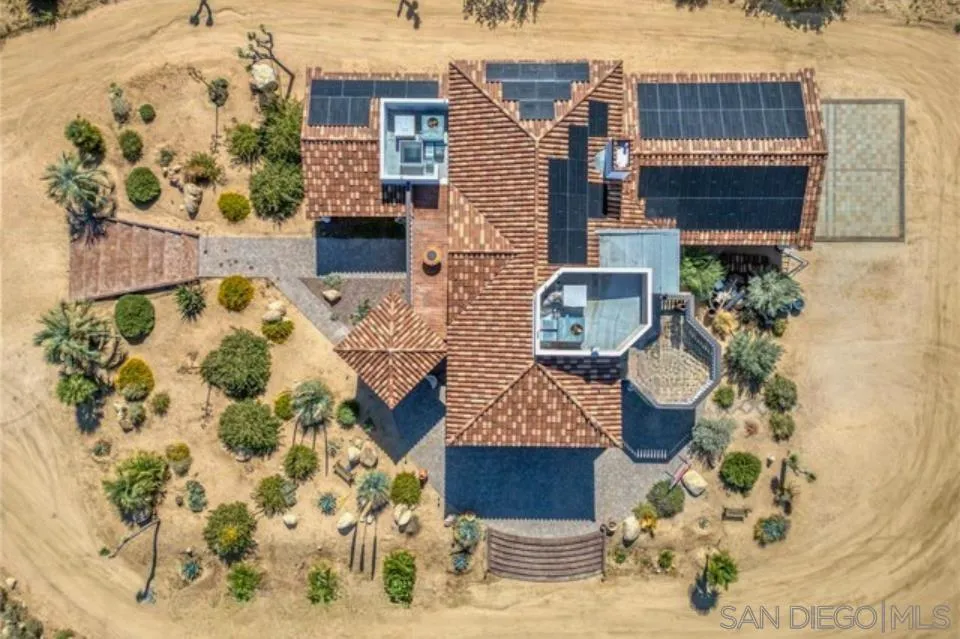 8022 Wesley Road Joshua Tree, CA 92252 - Photo 67 of 69 front view of a house with a potted plant
