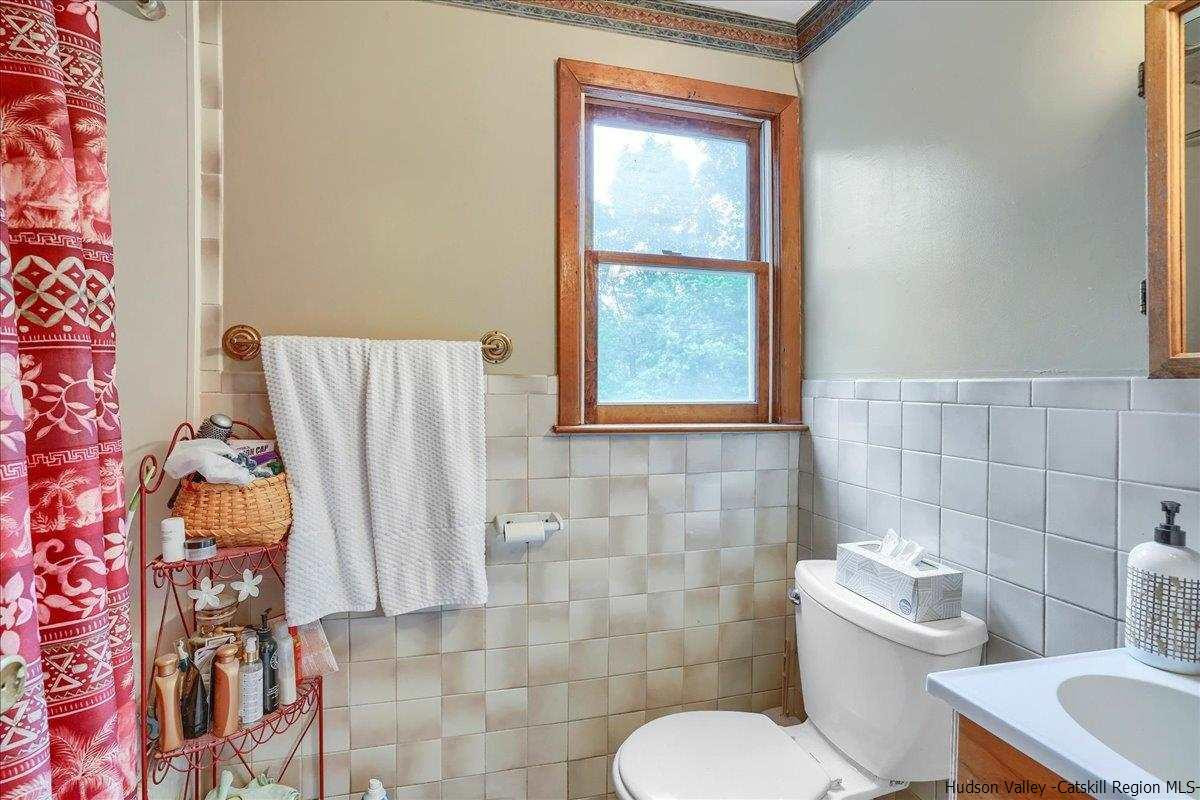 36 Cooper Road Monroe, NY 10950 - Photo 12 of 25 a bathroom with a toilet sink and mirror