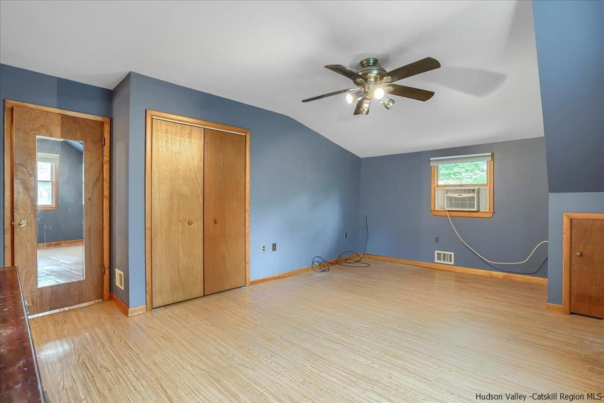 36 Cooper Road Monroe, NY 10950 - Photo 17 of 25 a view of a livingroom with a window and a ceiling fan