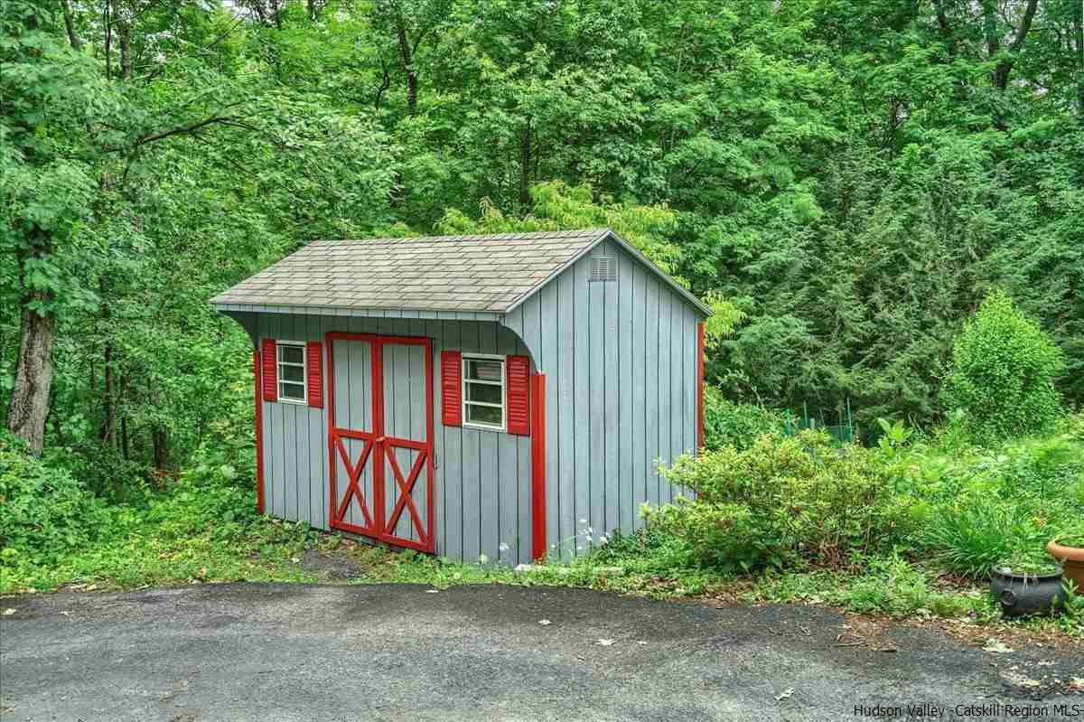 36 Cooper Road Monroe, NY 10950 - Photo 21 of 25 a front view of a house with garden