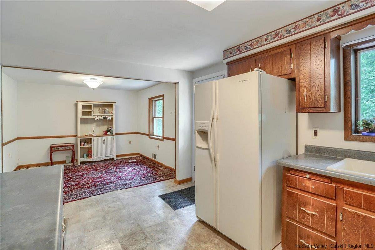 36 Cooper Road Monroe, NY 10950 - Photo 7 of 25 a kitchen with stainless steel appliances granite countertop a refrigerator and a stove top oven