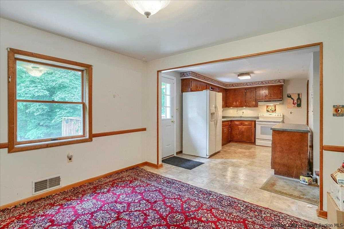 36 Cooper Road Monroe, NY 10950 - Photo 8 of 25 a living room with stainless steel appliances kitchen island granite countertop a refrigerator and a sink
