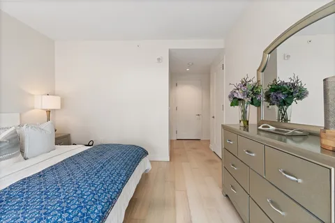 a spacious bathroom with a double vanity sink and a mirror
