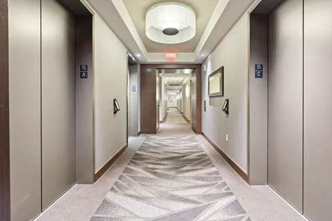 a living room with lots of furniture and a large window