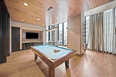 a view of a workspace with furniture