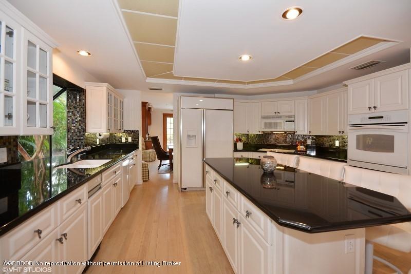 2213 Northwest 60th Road Boca Raton, FL 33496 - Photo 12 of 45 a large kitchen with a sink and cabinets