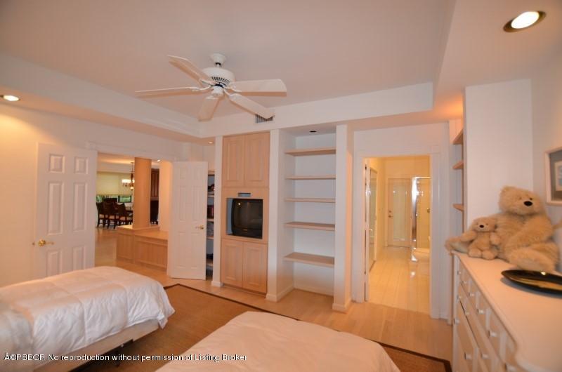 2213 Northwest 60th Road Boca Raton, FL 33496 - Photo 15 of 45 a bedroom with a bed and a walk in closet
