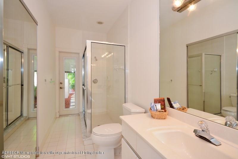 2213 Northwest 60th Road Boca Raton, FL 33496 - Photo 16 of 45 a bathroom with a sink toilet and shower