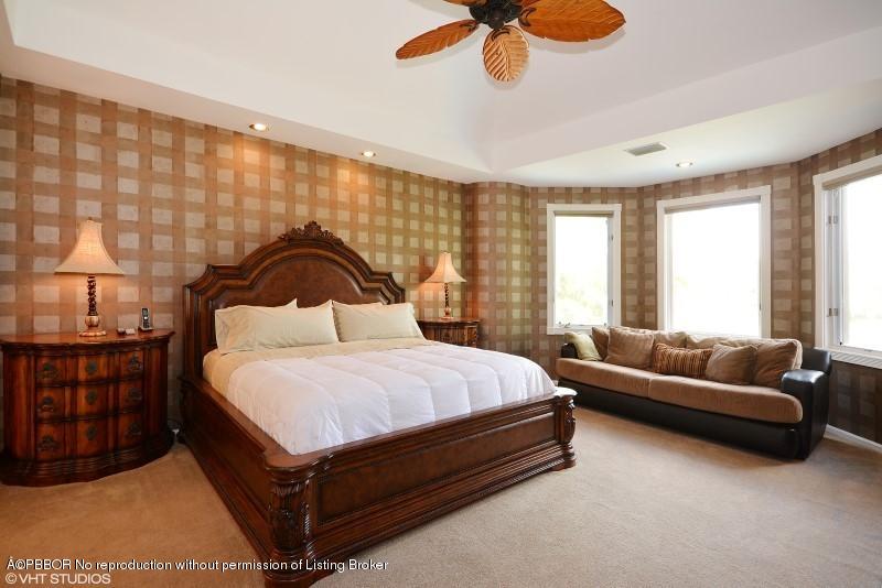 2213 Northwest 60th Road Boca Raton, FL 33496 - Photo 20 of 45 a bedroom with a bed couch and window
