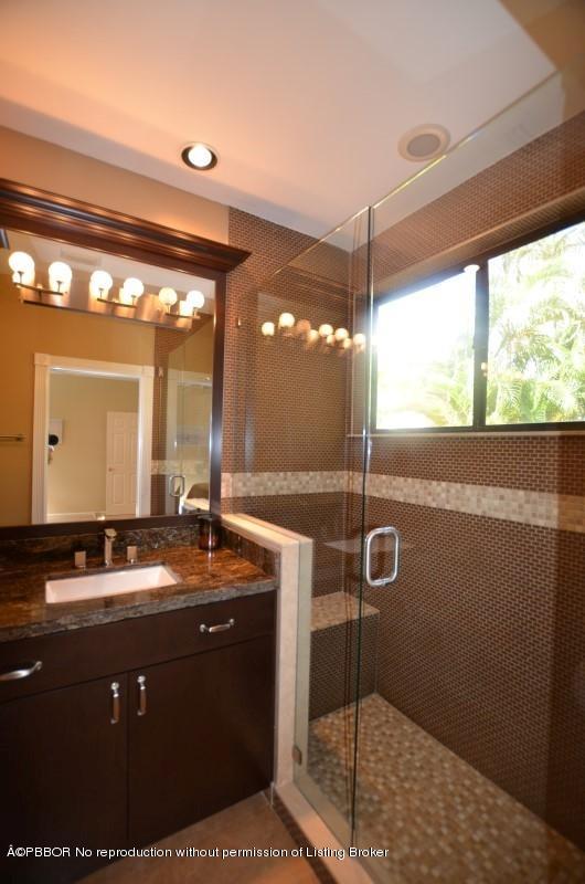 2213 Northwest 60th Road Boca Raton, FL 33496 - Photo 27 of 45 a bathroom with a granite countertop sink and a mirror