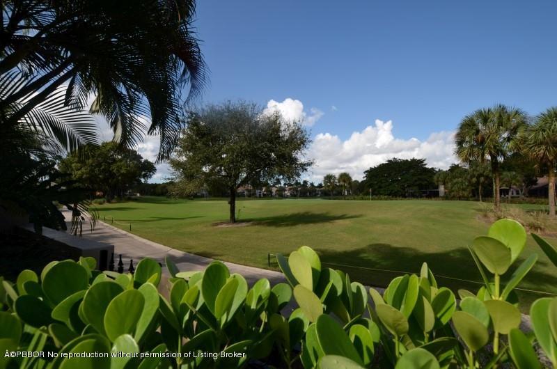 2213 Northwest 60th Road Boca Raton, FL 33496 - Photo 32 of 45 a view of a golf course with a lake