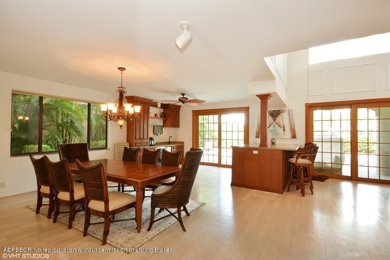 2213 Northwest 60th Road Boca Raton, FL 33496 - Photo 6 of 45 a dining room with furniture window and wooden floor