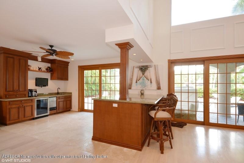 2213 Northwest 60th Road Boca Raton, FL 33496 - Photo 7 of 45 a view of a workspace with furniture and a window
