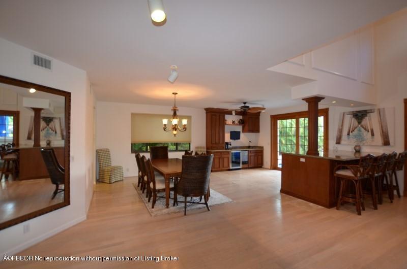 2213 Northwest 60th Road Boca Raton, FL 33496 - Photo 8 of 45 a dining room with furniture and chandelier