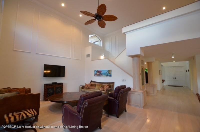 2213 Northwest 60th Road Boca Raton, FL 33496 - Photo 9 of 45 a living room with furniture and a flat screen tv