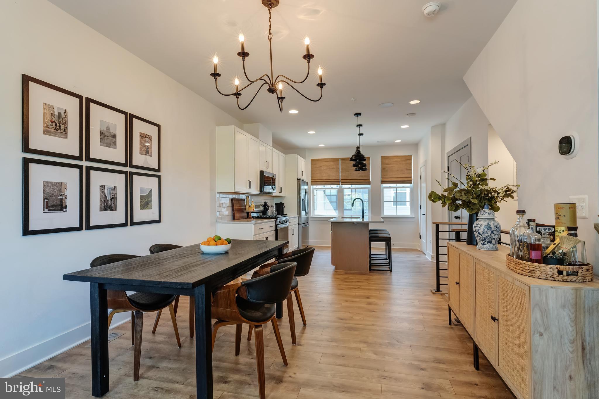 11237 Beaker Street Reston, VA 20190 - Photo 11 of 45 a view of a dining room with furniture and wooden floor