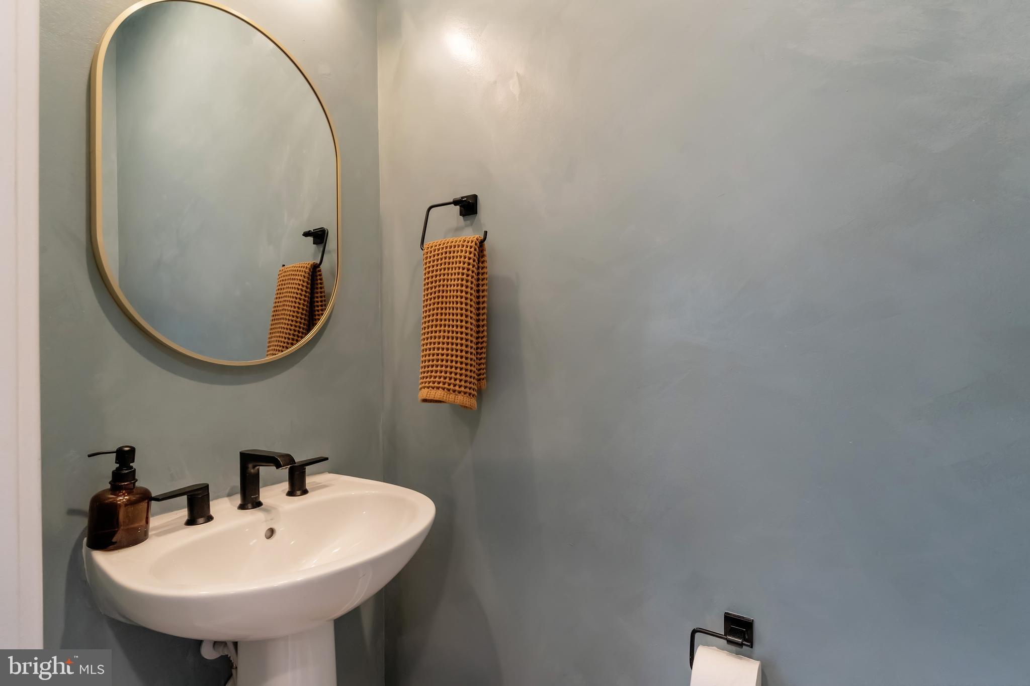11237 Beaker Street Reston, VA 20190 - Photo 15 of 45 a bathroom with a sink and a mirror