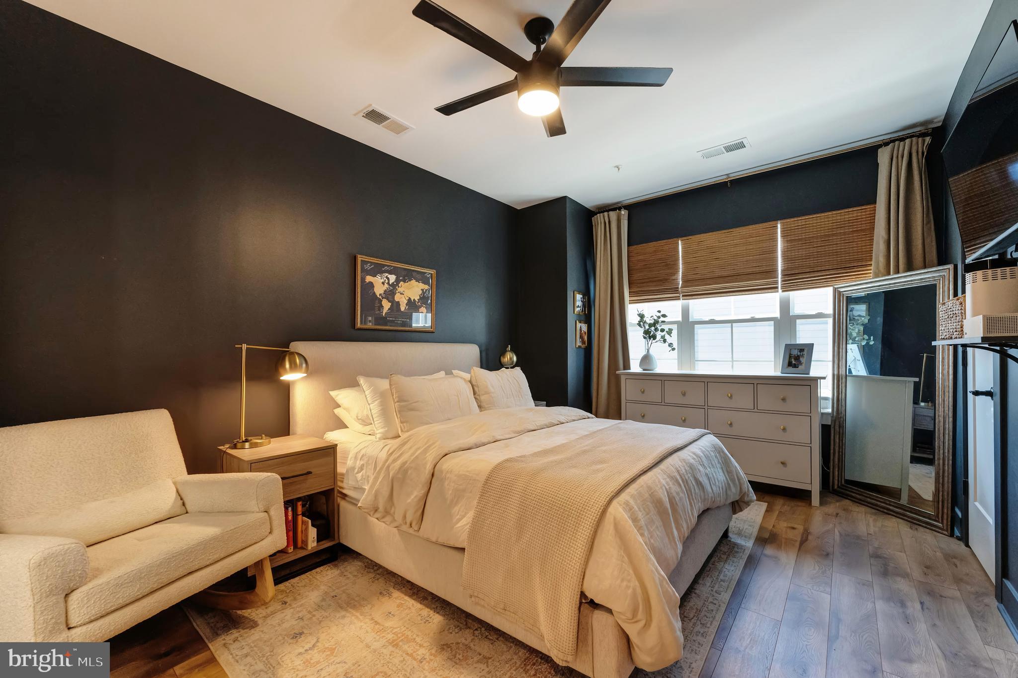 11237 Beaker Street Reston, VA 20190 - Photo 17 of 45 a bedroom with a bed and a large window
