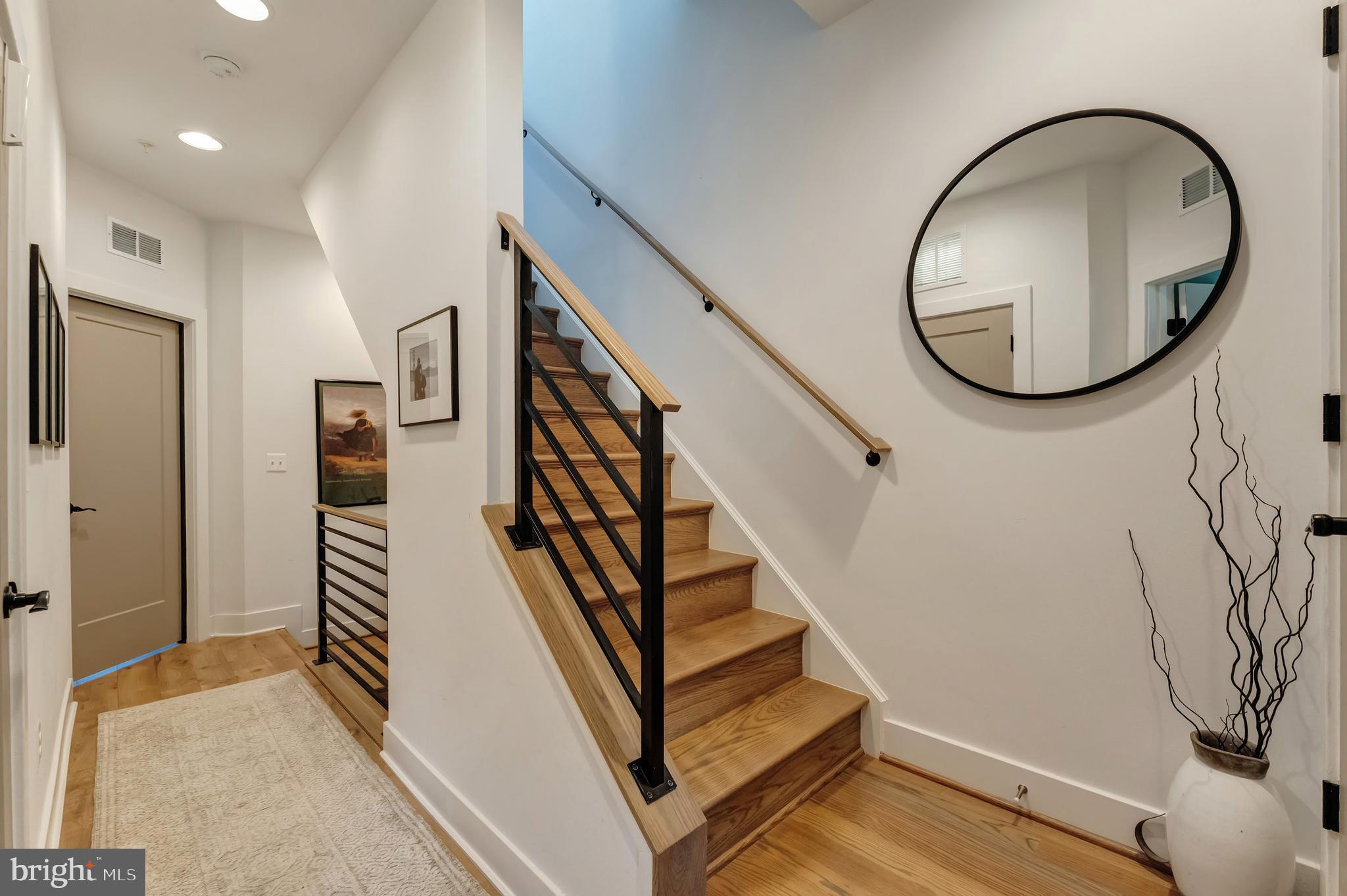 11237 Beaker Street Reston, VA 20190 - Photo 26 of 45 a view of an entryway with wooden floor