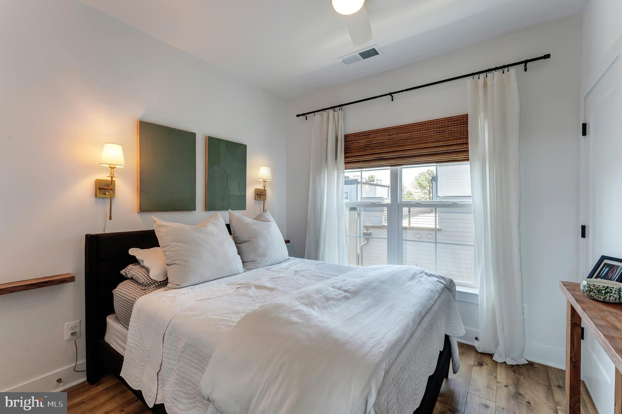 11237 Beaker Street Reston, VA 20190 - Photo 30 of 45 a large bedroom with a bed and a large window