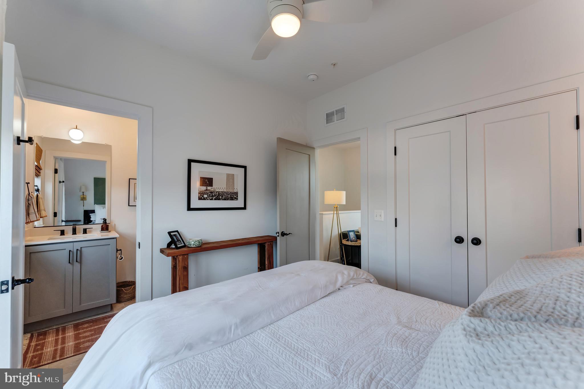 11237 Beaker Street Reston, VA 20190 - Photo 32 of 45 a bedroom with a bed and a dresser
