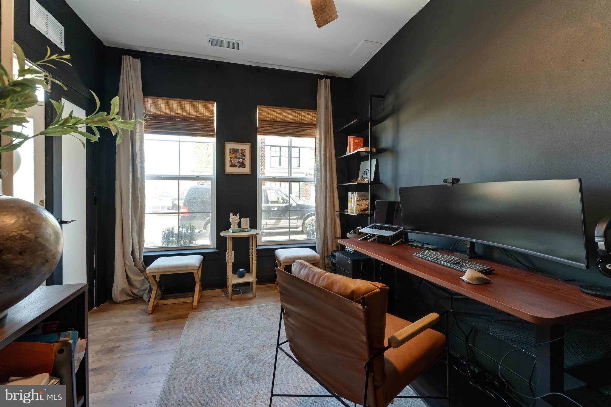 11237 Beaker Street Reston, VA 20190 - Photo 4 of 45 a view of a workspace with furniture and a window