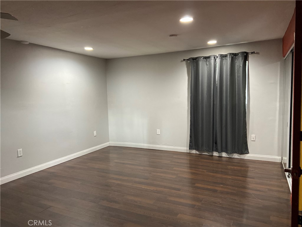 10756 Haddon Avenue Pacoima, CA 91331 - Photo 12 of 22 an empty room with wooden floor and closet