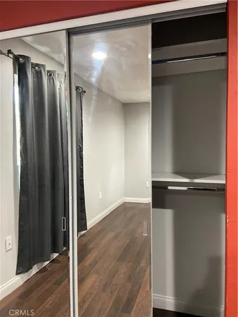 a kitchen with stainless steel appliances a counter top space and cabinets