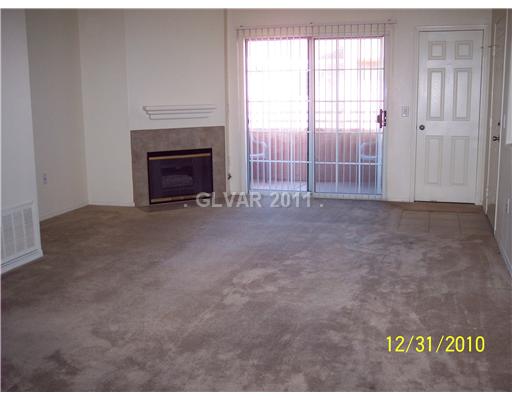 3318 North Decatur Boulevard, Unit 2086 North Las Vegas, NV 89130 - Photo 9 of 12 Living Room. Living room opens up into dining area and kitchen for entertaining