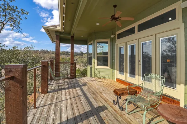 a balcony with furniture and a potted plant