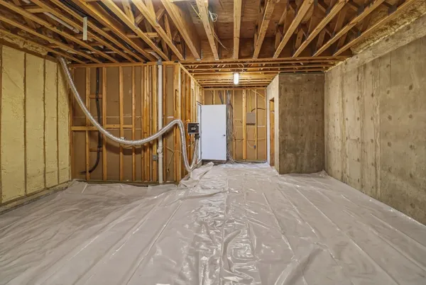 a view of a room with wooden walls