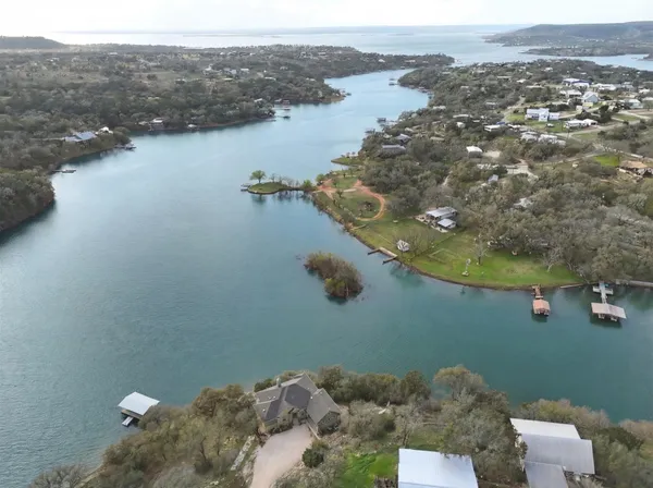 an aerial view of a house with a lake view