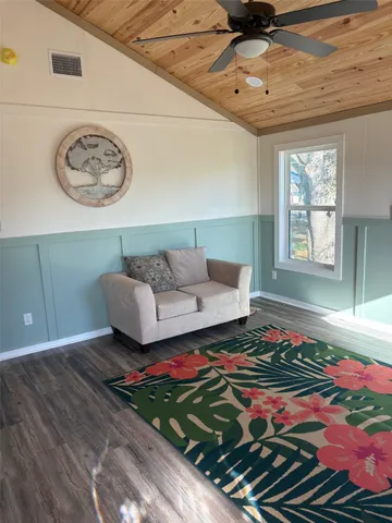 a kitchen with stainless steel appliances kitchen island granite countertop a stove a sink and a refrigerator