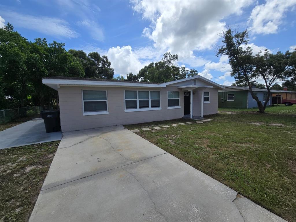 316 Hatfield Road Winter Haven, FL 33880 - Photo 1 of 1 front view of house with a yard