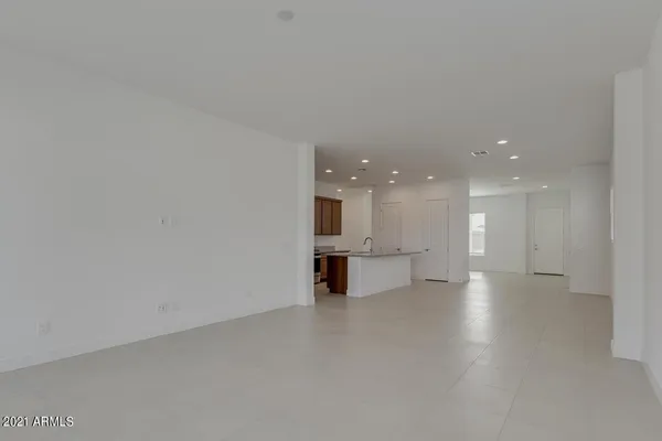 a view of a big room with kitchen view and a window