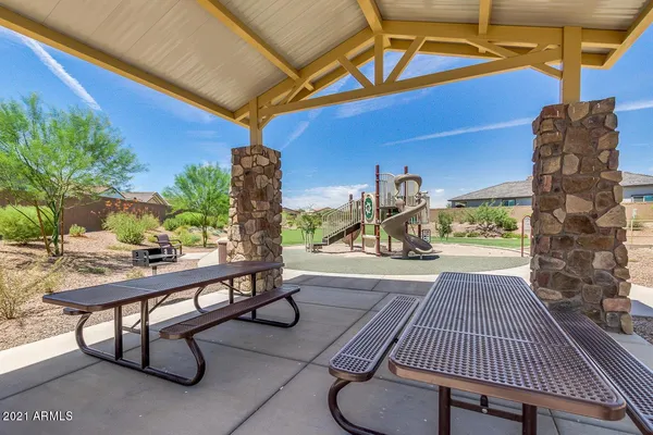 a view of a patio with a table and chairs