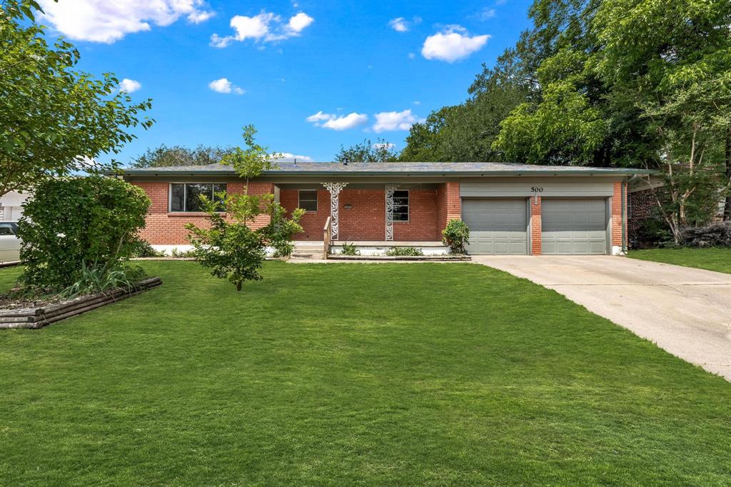 500 Vine Street Euless, TX 76040 - Photo 1 of 1 a front view of house with a garden and patio