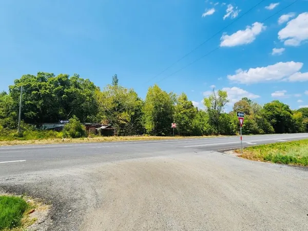 a view of a swimming pool and a yard
