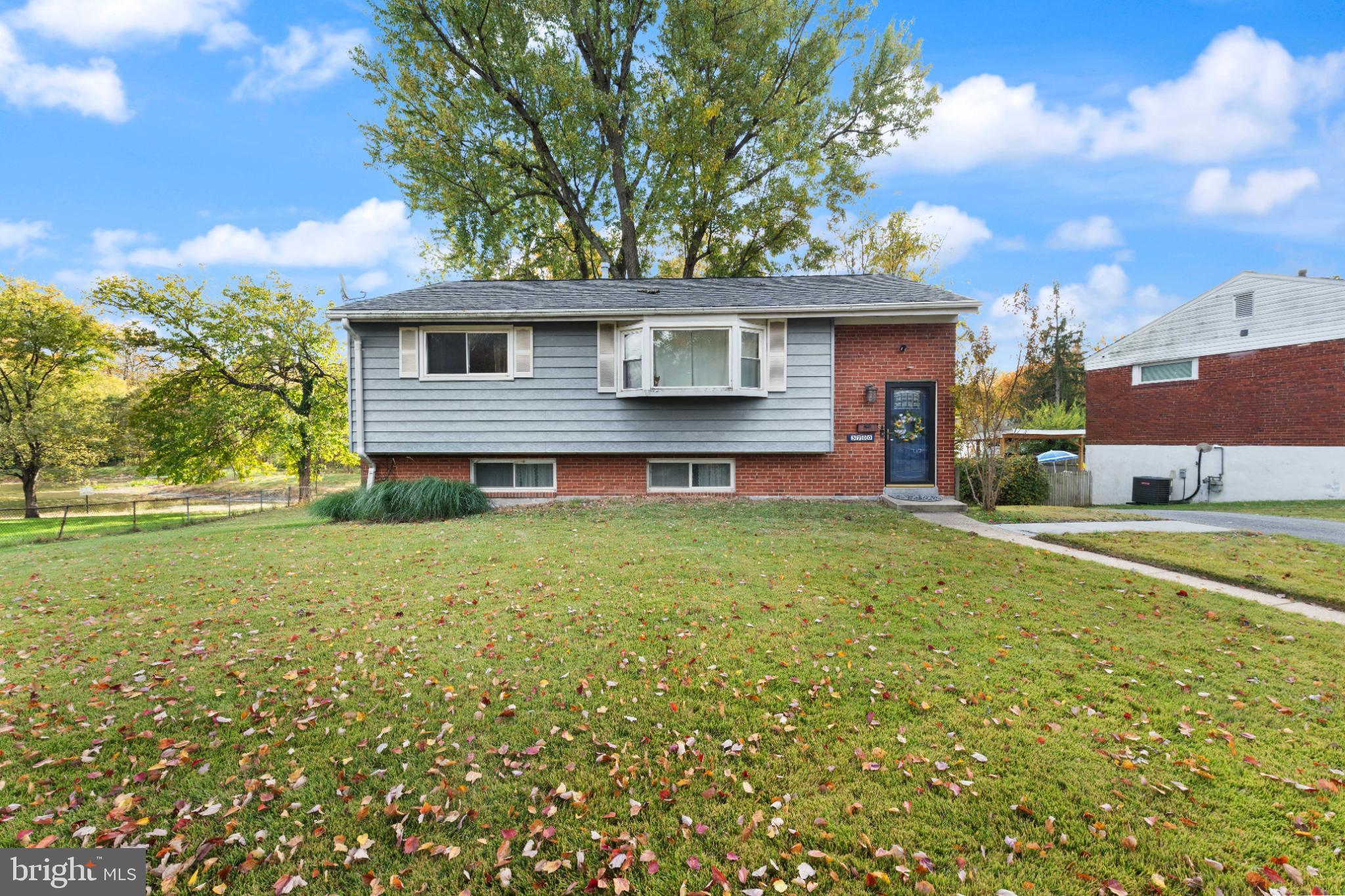 3700 Ralph Road Silver Spring, MD 20906 - Photo 2 of 30 Charming split-level home with lush greenery.