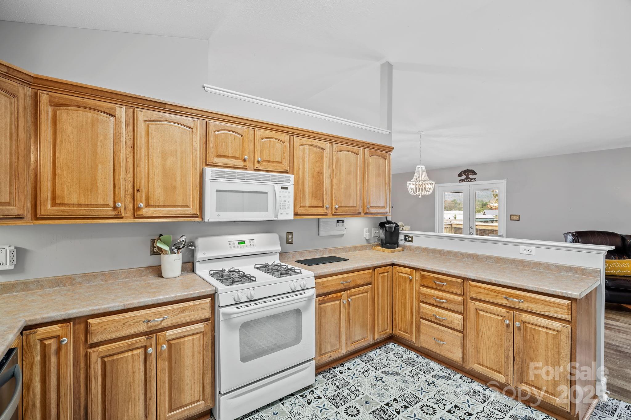 21 Presbyterian Church Road Mills River, NC 28759 - Photo 14 of 48 a kitchen with a sink stove and cabinets