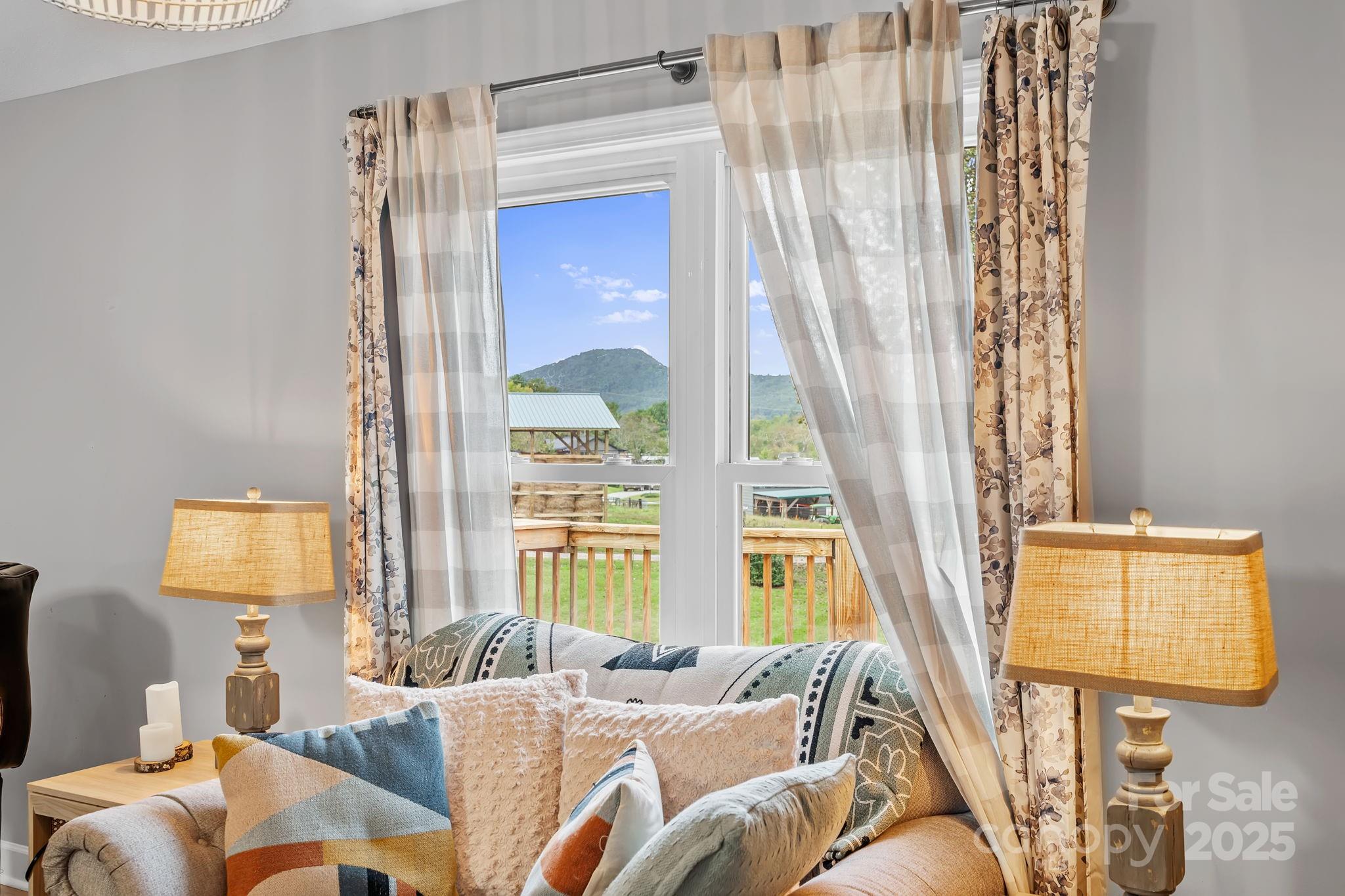 21 Presbyterian Church Road Mills River, NC 28759 - Photo 16 of 48 a living room with furniture and a large window