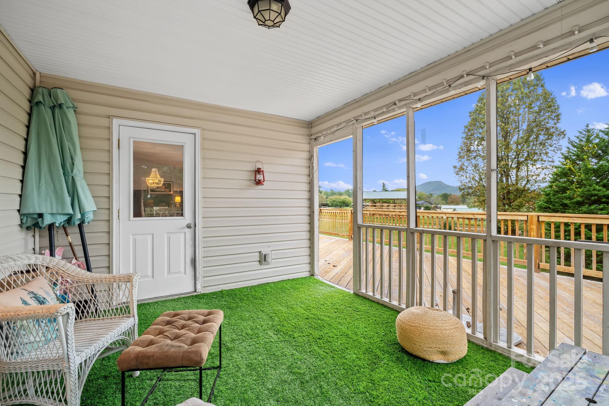 21 Presbyterian Church Road Mills River, NC 28759 - Photo 18 of 48 a view of a porch with furniture and a gate