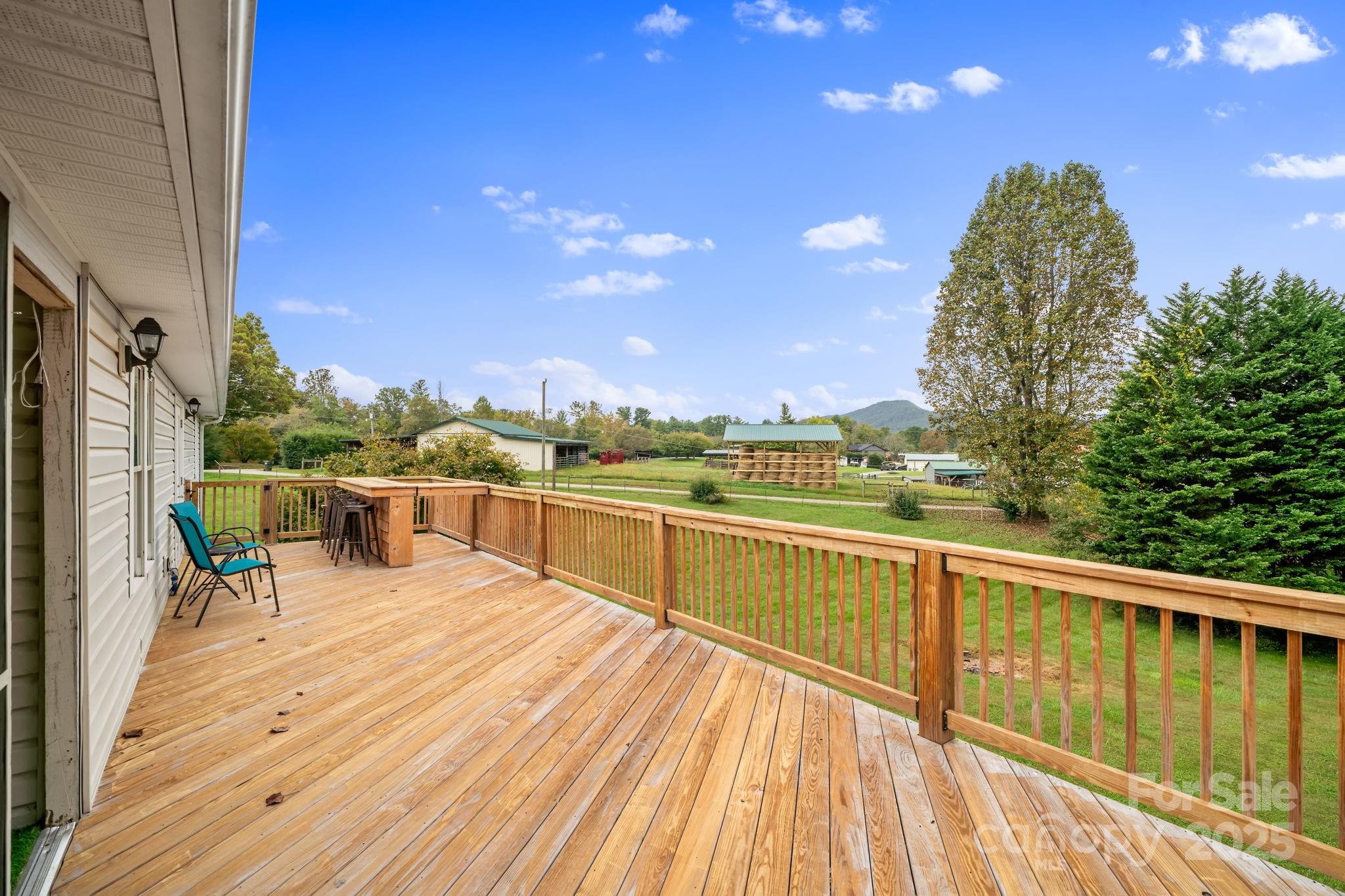 21 Presbyterian Church Road Mills River, NC 28759 - Photo 2 of 48 a view of a balcony with wooden floor and outdoor space